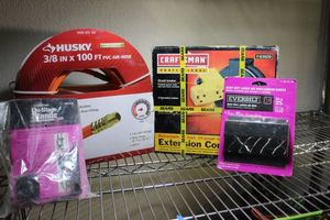 lot 57 image: Craftsman 30 Extension Cord Retractable Reel Husky 100 Hose and Heavy Duty Hangers