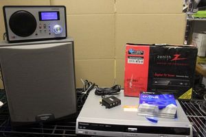 lot 123 image: Panasonic HDDDVR Player and Recorder, Livio Internet Radio, Paradigm Speaker, and Zenith Digital TV Tuner