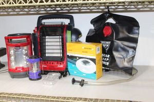 lot 118 image: Outdoors and Camping Supplies, Propane Coleman Heater with Small Propane Bottle, Camping Shower, Floating Solar Light and Much more