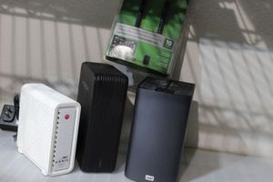 lot 145 image: Hitachi Live Desk External Hard Drive 1TB and My Book Live Duo 4TB and Wireless Router