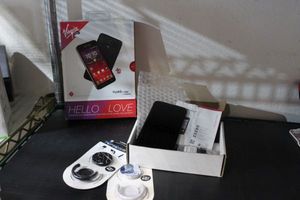lot 216 image: Virgin HydroVibe cell phone and LG Premier LTE Cell Phone Both Unused and 2 Pop sockets