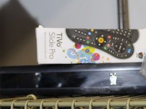 lot 102 image: Tivo System with Remote and Plush Tivo Logo