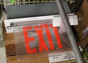 lot 107 image: Three Boxes of Edge Lit Exit Signs