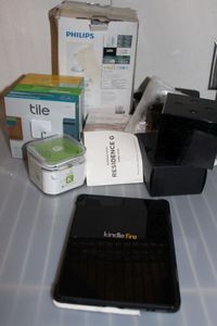 lot 116 image: Kindle Fire, Cube, Small K and Tile Pro key chains and master tile and more .. See photos