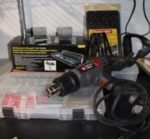 lot 152 image: Magnetic Tool Organizers, Porter Cable Heat Gun, and plastic hardware organizers