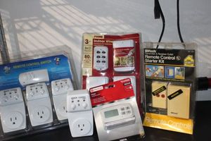lot 153 image: Wireless Home Plugs with remote controls