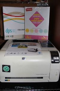 lot 199 image: HP LaserJet printer CP1525 and printercopier paper (printed page shown was printed at time of photo)