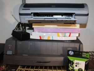 lot 103 image: HP Laser Jet Printer and electric Hole punch stapler and several reems of copyprinter paper