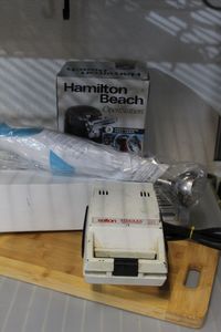 lot 253 image: Hamilton Beach Electric Can Opener, Single Sandwich Maker Wooden Cutting board and wand blender
