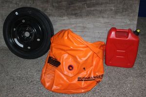 lot 264 image: 18 Spare Tire, 5 Gallon Bush Ranger Air Pillow Jack 4x4 Missing Air Stopper