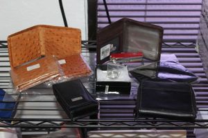 lot 12 image: Unused Mens Wallets and Swiss Army Knife and Mens Fashion ring