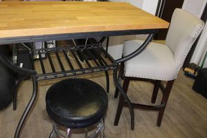 lot 29 image: Bar Height Table Needs new Top with 2 different Bar Stools