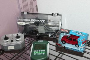 lot 39 image: Remote Controlled Helicopter Football Game and Collectable Toy Truck