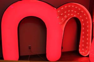 lot 65 image: Large Commercial LED Letter M Damaged as shown in photos, This will have a scheduled Pick up