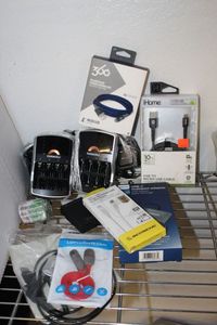 lot 56 image: Duracell Battery Charger with Rechargeable AA &AAA Variety of Unused Charging Data Cables and well as a turn speed fast charger