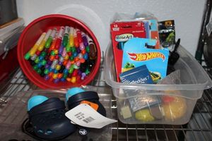 lot 93 image: Bucket of Markers, Coloured Pencils, Rubber Ducky, Hot wheel Car and Various Birthday Cards for Kids