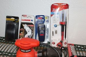 lot 114 image: Black and Decker Sander and Variety of unused items