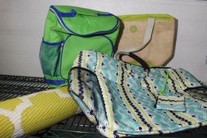 lot 130 image: NewUnused BeachLake ItemsRolling Soft Sided Cooler, Wet Bags (2) and Lounge Mat
