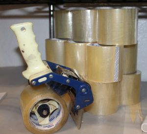 lot 140 image: Exra Wide Tape Gun and Fifteen (15) Rolls of Tape
