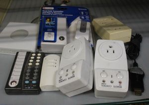 lot 142 image: Net Gear Wireless Inerface adapter and Home Automation Plugs
