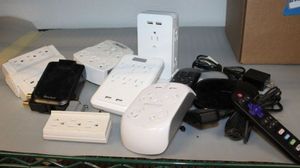 lot 143 image: Plugs and Surge Proectors and Roku Streaming Device with Remote
