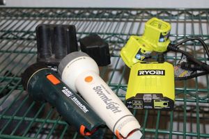 lot 165 image: Two Black and Decker Flashlights with Charger no Batteries, Ryobi Power Pack