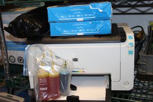 lot 200 image: HP Laser Jet 1025 Printer with Toner Cartridge and Refill Ink and Two (2) Reems of CopyPrinter Paper