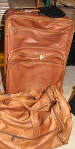 lot 238 image: Brown Leather Luggage and Black Leather Wallet. Rolling Suitcase Brand Pier and Brown Leather Duffle Bag