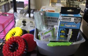 lot 205 image: Misc Box of this and thangand ohh thats so cool along with weather stripping and floor scrubber and more