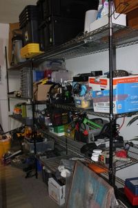 lot 283 image: Metro rack, this will have a scheduled pick up and buyer is responsibility for disassembly These shelves dont have all poles, the middle section shelves are held up with z clips  Please preview