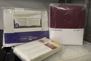 lot 382 image: Calvin Klein Cal-King Fitted Sheet, a King Sheet set and a pair of King Pillow Cases