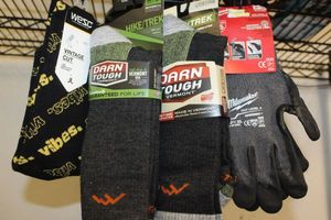 lot 414 image: Two Pair Vermont Socks, Wezc Socks, and Milwaukee Gloves.. All are unused with tags