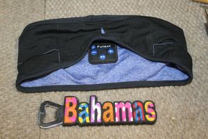 lot 415 image: Headband with Bluetooth player built 8. And a Bahamas Bottle opener