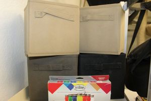 lot 440 image: Small Cloth Storage Cubes and Box of enamel Paints
