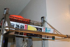 lot 460 image: Two Over the Door Closet Rods, one is Unused still in the Box