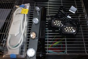 lot 518 image: Utrusta Light, Battery Track Light, Mag-Lite Flashlight, and 2 LED spotlights