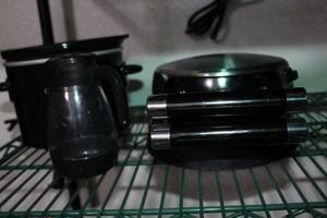 lot 392 image: Small Flip Waffle Maker, small Crock pot and Syrup Dispenser