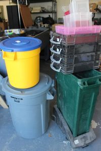 lot 603 image: Trash cans as shown and small totes as shown