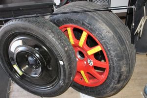 lot 606 image: Two Spare Tires 18 and tire pull rod