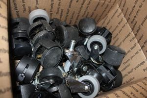 lot 536 image: Quantity of Plastic Casters Some with Screw on and some with Press on Attachments