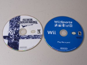 lot 26 image: Lot of 2 - Nintendo Wii Games Super Smash Bros. Brawl, Wii Sports
