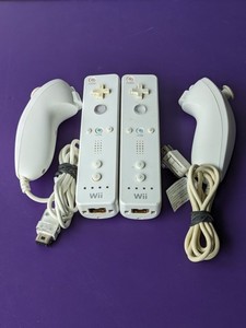 lot 181 image: Lot of 2 - Nintendo Wii Controllers  2 NunChucks