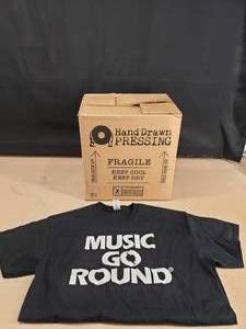 lot 136 image: Large Box Full of Music Go Round T-shirts.  Approx 40 Pieces (Mostly Large)