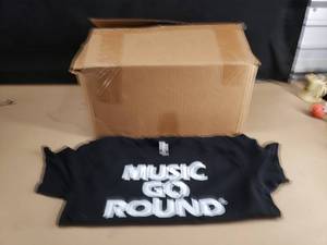 lot 137 image: Large Box Full of Music Go Round T-shirts.  Approx 52 Pieces (Approx 16 Large & 36 XL)