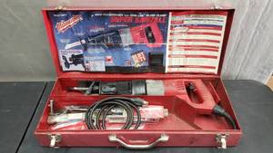 lot 25 image: Milwaukee Model 6537-22 Heavy Duty Super Sawzall w Steel Case & Lots of Extraq Blades