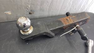 lot 40 image: Tow Hitch w 2 Ball & Tire Iron