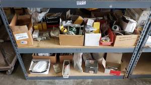 lot 154 image: Contents of Bottom 2 Shelfs.  Misc Outlet & Switch Covers, Switches, Plugs & More.