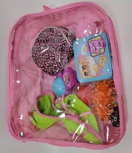 lot 148 image: TOYS INSIDE OF A PINK BACKPACK