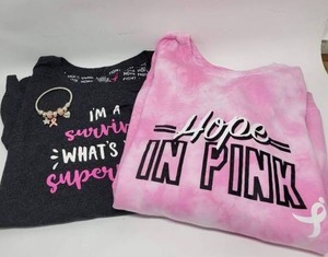 lot 214 image: PINK LOT - SUSAN G KOMEN SHIRTS SIZE XL  CHARM BRACELET