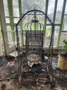 lot 230 image: Large ornate wrought iron birdcage and stand
